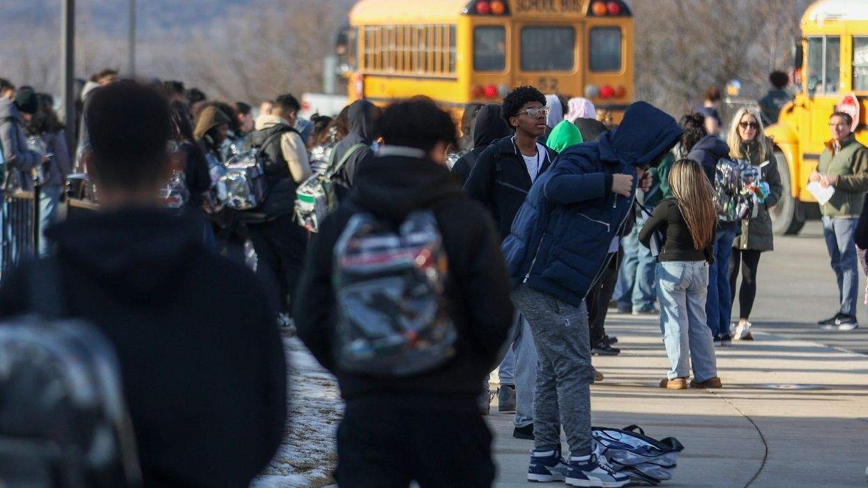 students walking to school buses