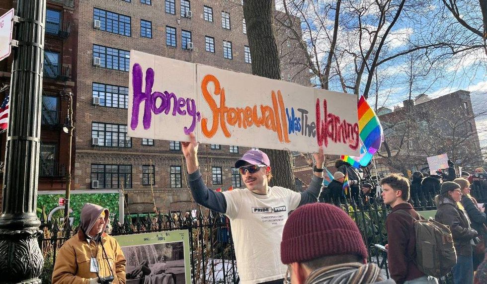 supporter sign reads honey stonewall was the warning