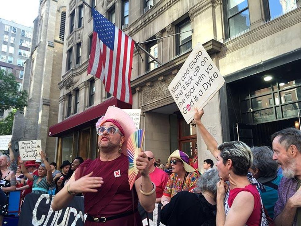 Supporters from the sidelines sing in drag.