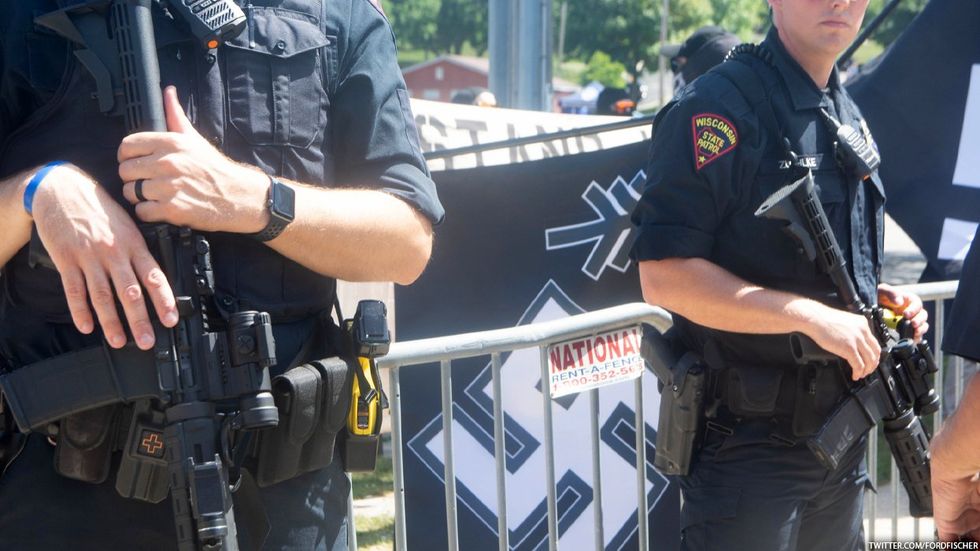 Swastika flag and Wisconsin State Patrol officers