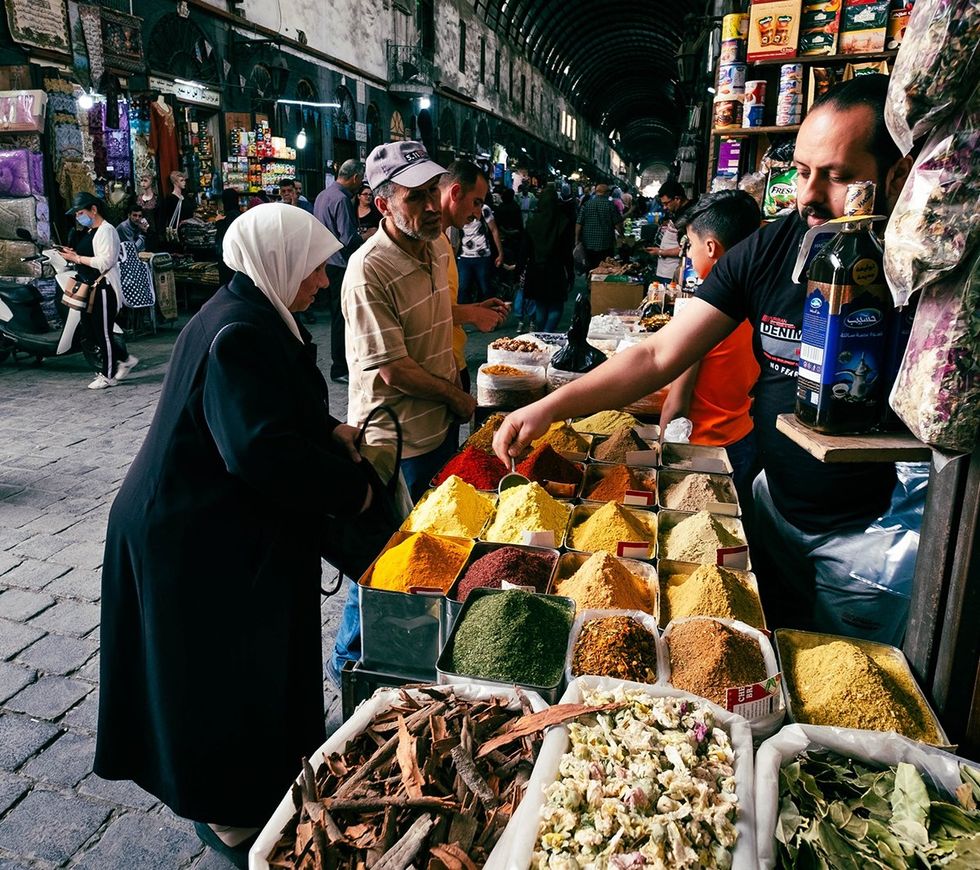 Syria food herbal spice seller at Suq Al Hamidiyah street market in Damascus