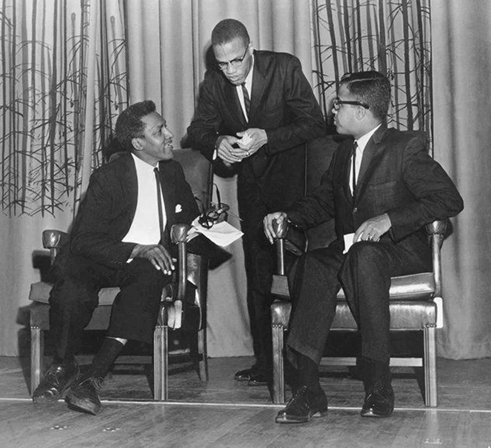 Taking a break with Malcolm X and debate moderator Michael R. Winston at Howard University, October 1961. Courtesy Moorland-Spingarn Research Center, Howard University Archives.