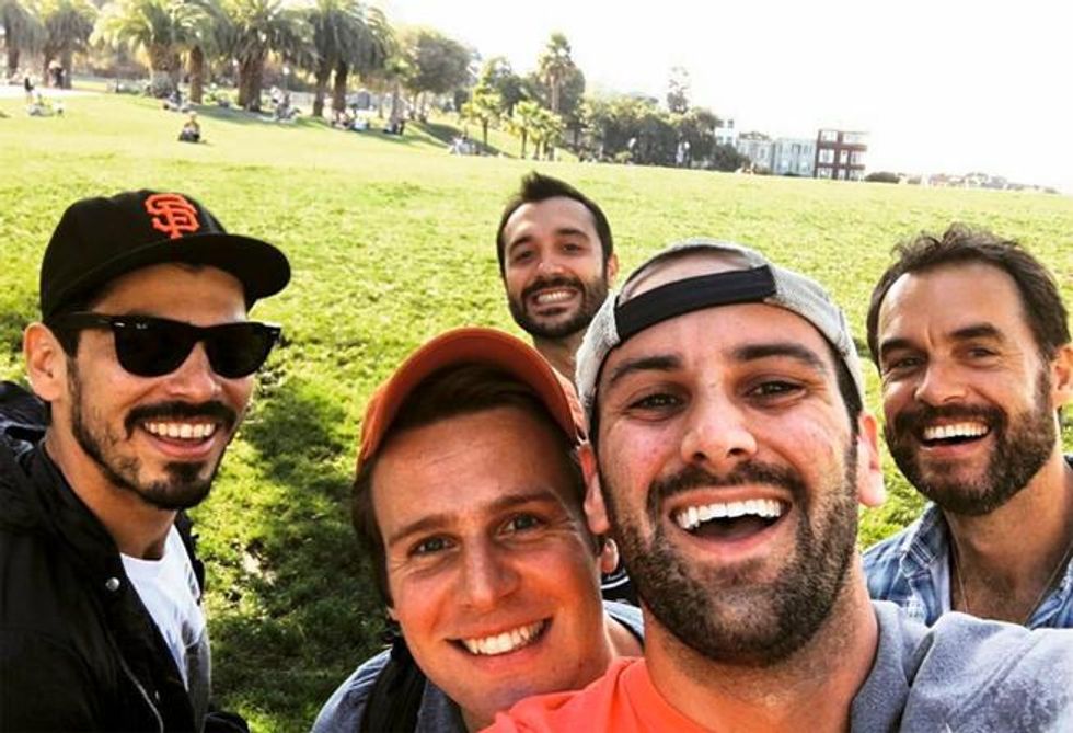 The cast and crew, including Raul Castillo (far left), playing around in a San Francisco park.