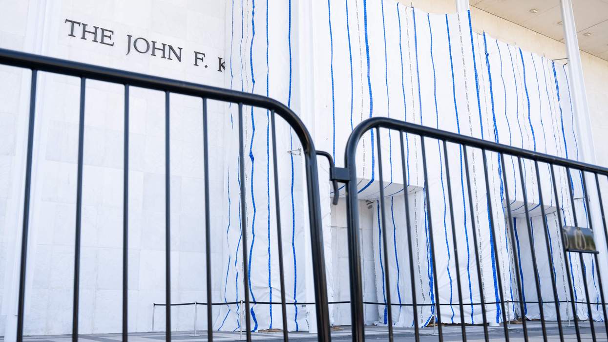 The Kennedy Center surrounded by fencing.
