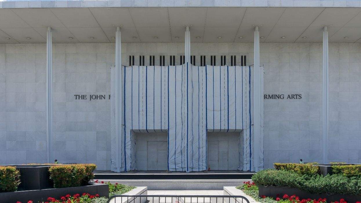 the kennedy center with a tarp obscuring its name