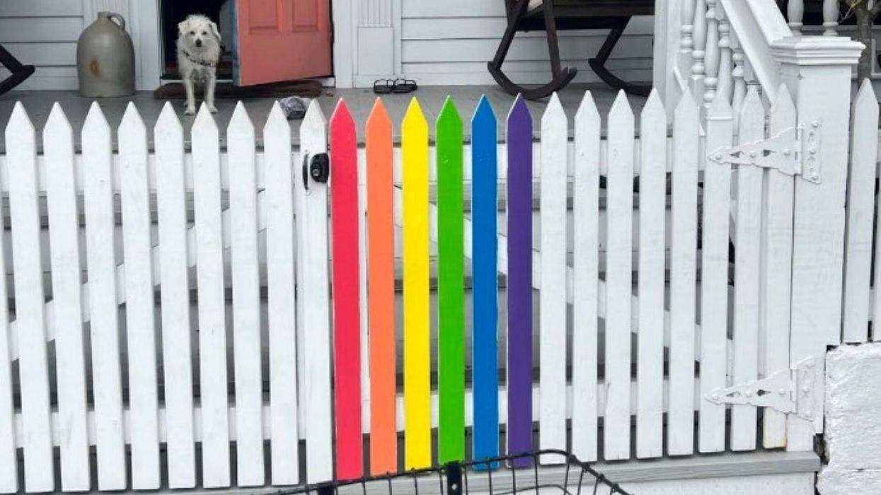 the key west home of a lesbian couple has a rainbow segment of fence