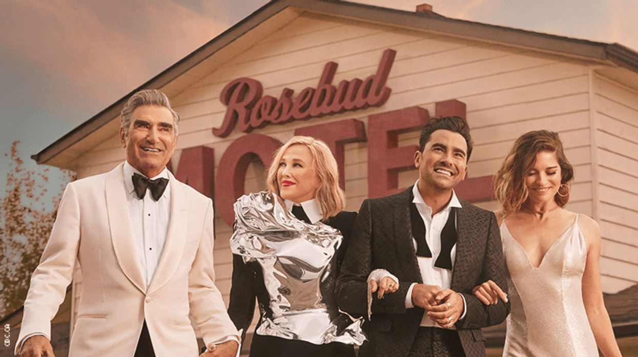 The Schitt's Creek cast in front of the Rosebud Motel
