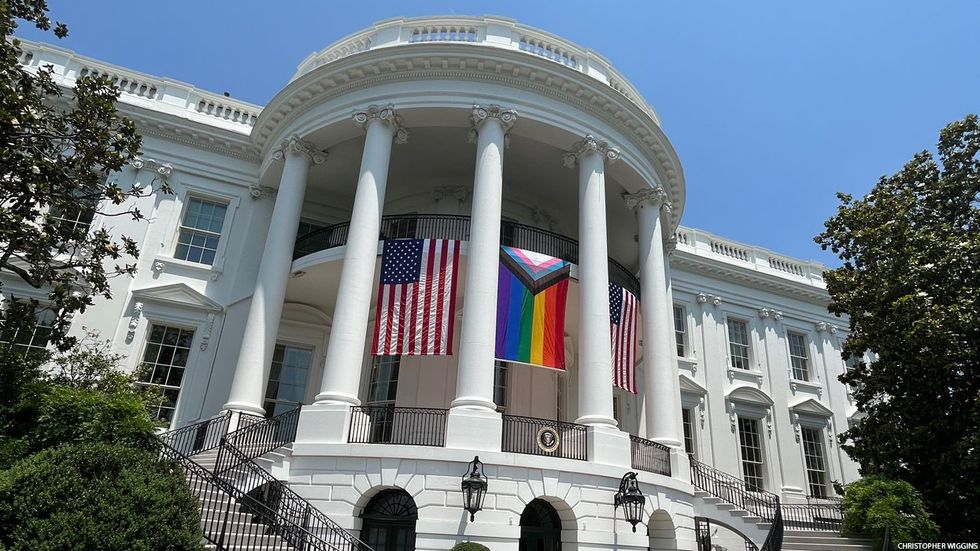 The White House with Pride and U.S. flags