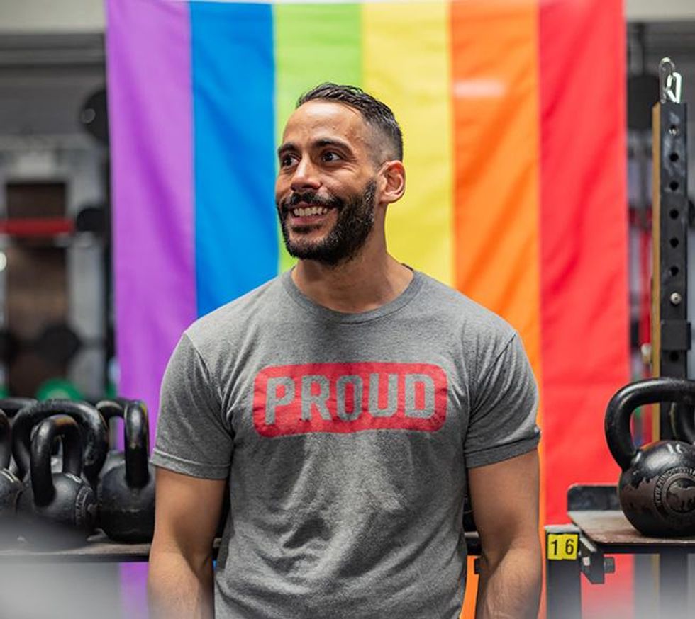 Todd Brandon Morris, founder of OUT-FIT, and coach at CrossFit NYC, wearing his company\u2019s \u201cProud\u201d t-shirt.
