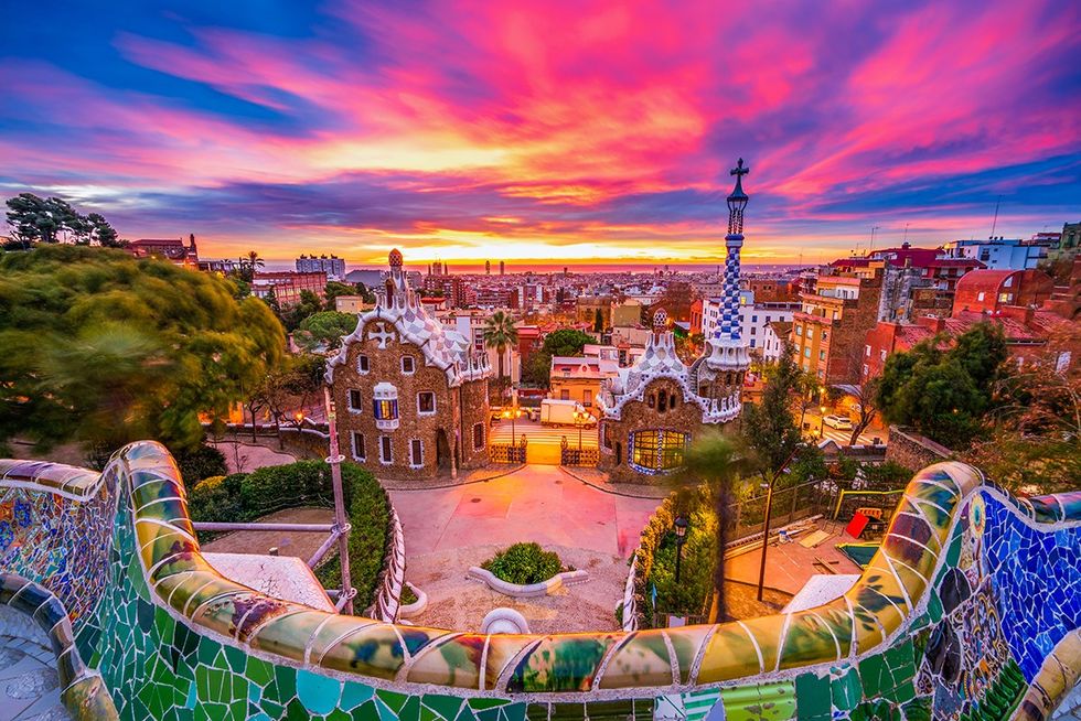 Top 15 safest countries for LGBTQ+ travelers - Gaudi\u2019s famed Park Guell at sunset in Barcelona, Spain