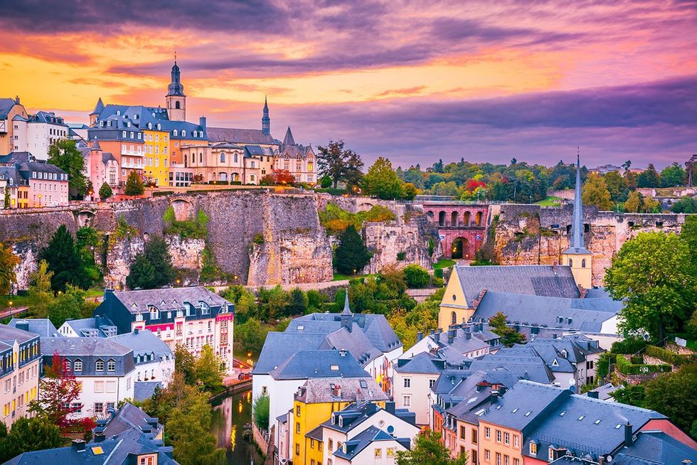 Top 15 safest countries for LGBTQ+ travelers - Luxembourg City\u2019s old town overlooking the Alzette River at twilight