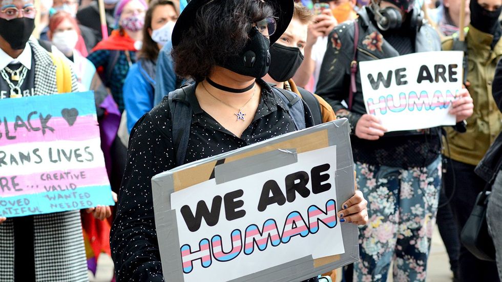 transgender humans protest signs
