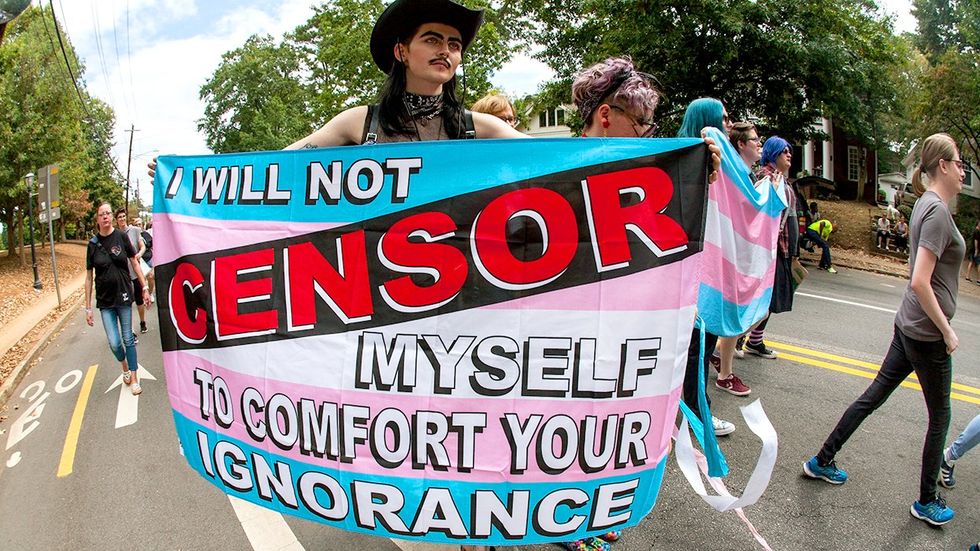 transgender person carries flag will not censor myself comfort your ignorance LGBTQ pride parade Atlanta Georgia USA South