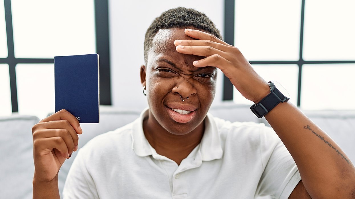 Transgender Person Gender Nonconforming Human Confused Holding Passport Government Identification