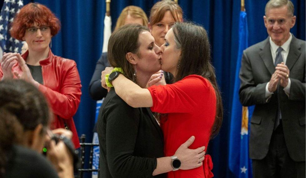 transgender service member retirement kissing wife