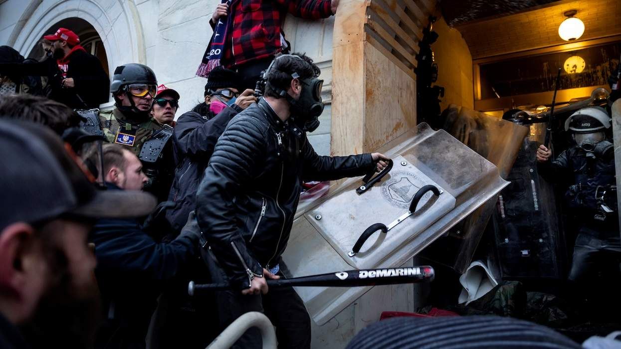 Trump supporters clash with police and security forces as people try to storm the US Capitol on January 6, 2021 in Washington, DC.