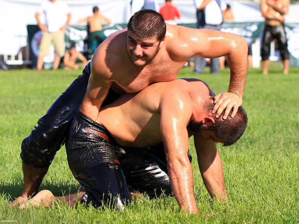 turkish men oil wrestling in the grass