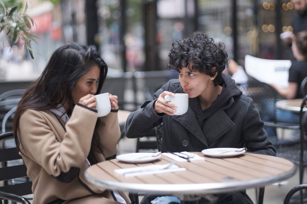 Two lesbians having coffee