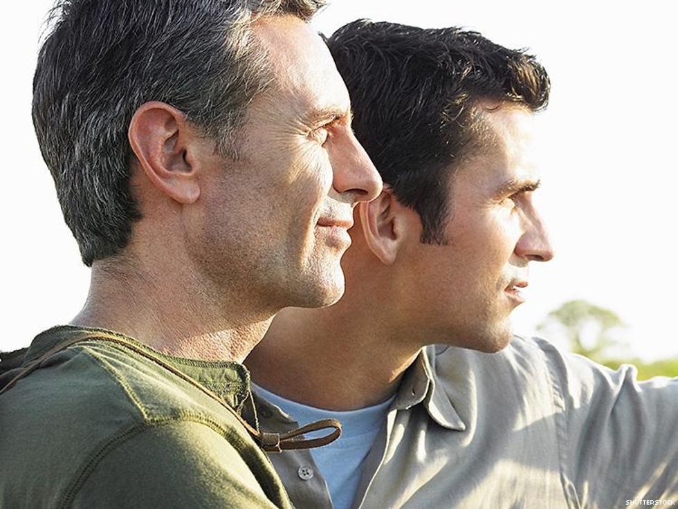 two men looking off in the distance