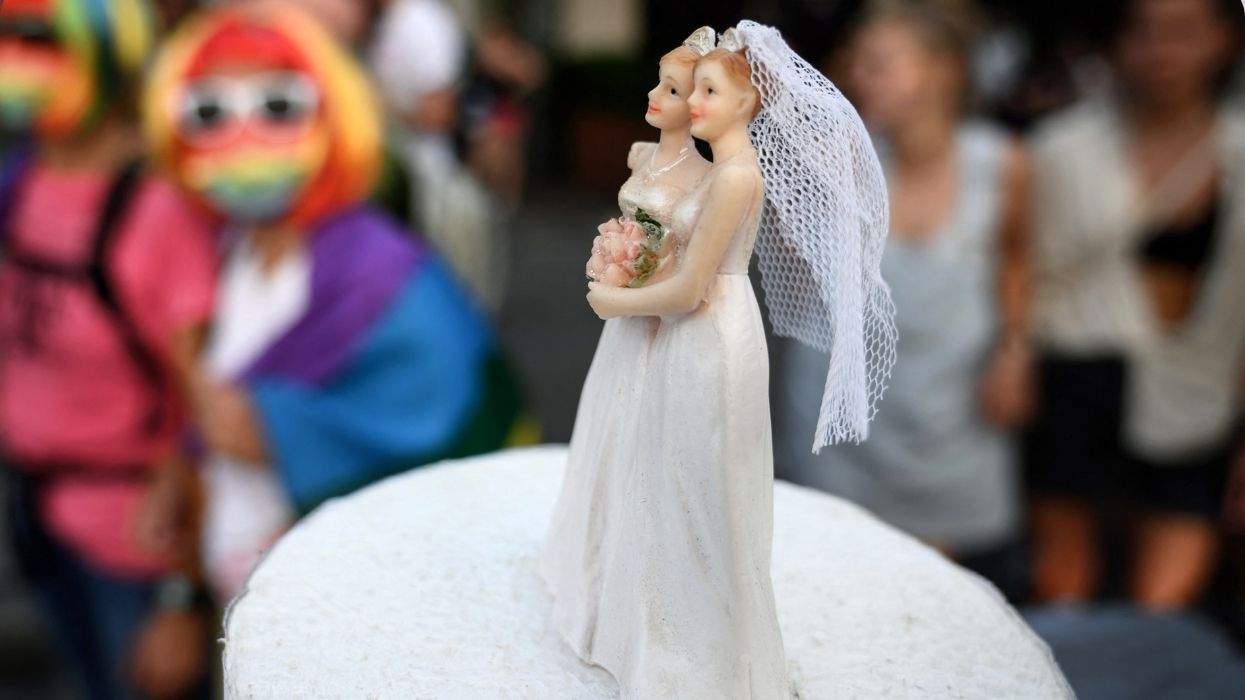 two women wedding cake topper