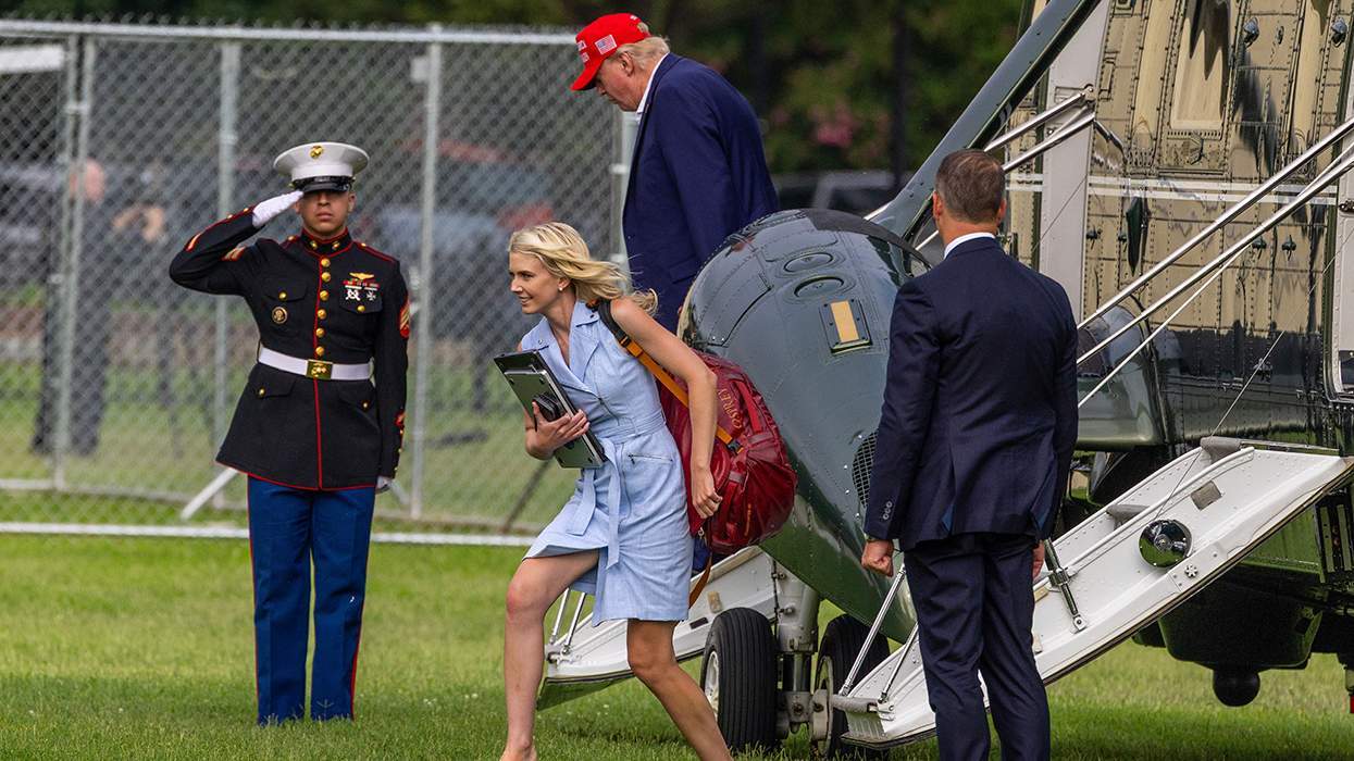 U.S. President Donald Trump steps off Marine One along with Natalie Harp.