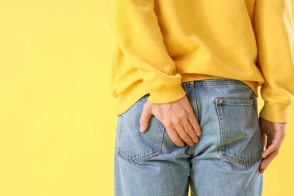 \u200bMan holding his butt.
