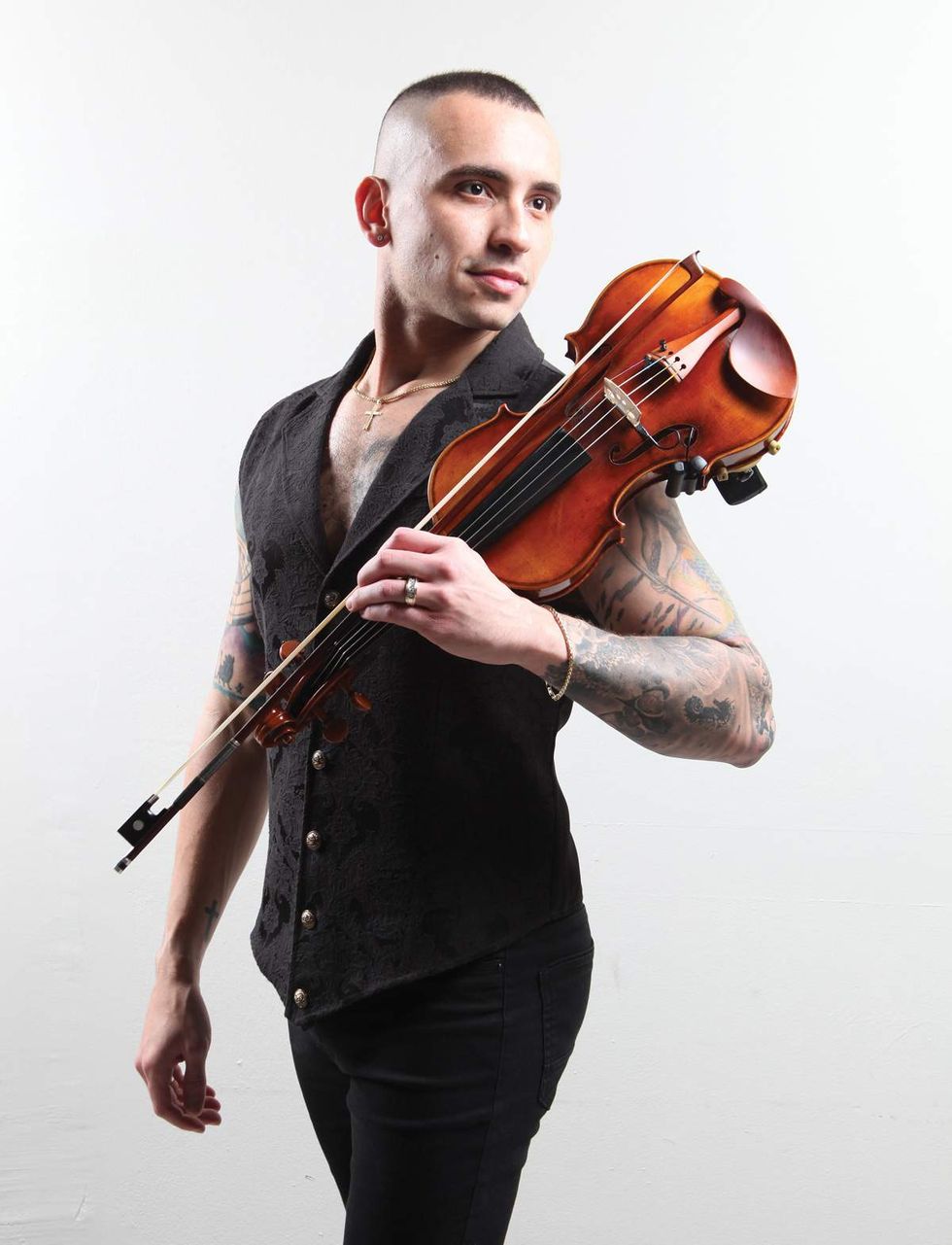 \u200bMarcos Aycox poses with his violin