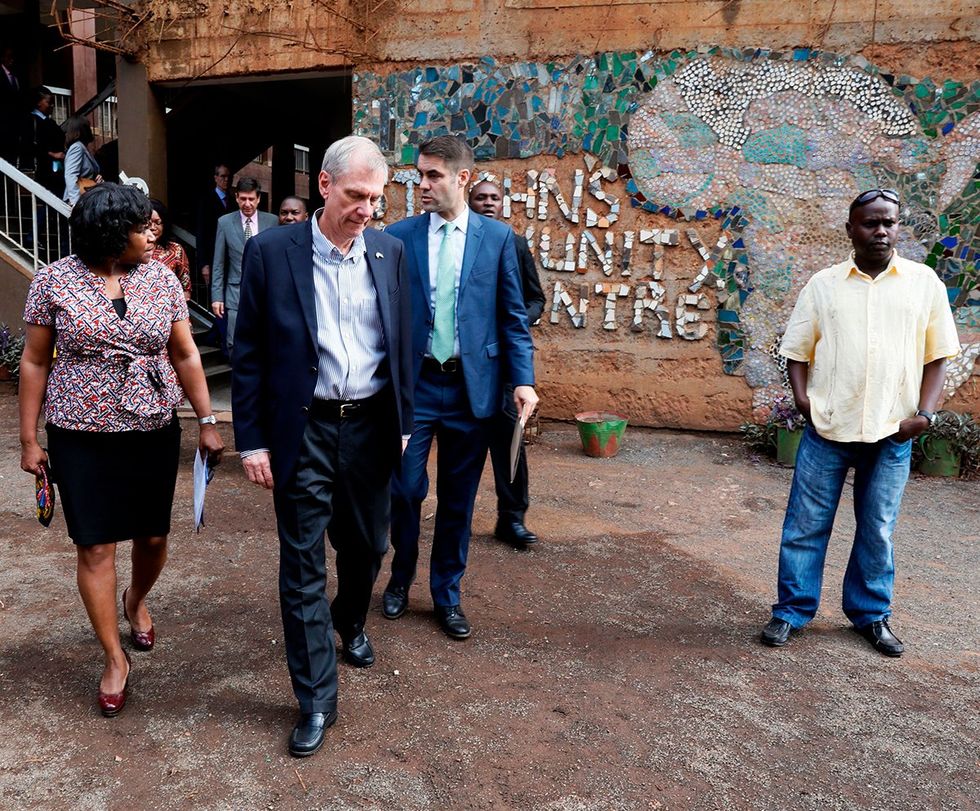 US Ambassador to Kenya Robert Godec pictured center visits a Presidents Emergency Plan for AIDS Relief PEPFAR project promoting girls empowerment in Nairobi