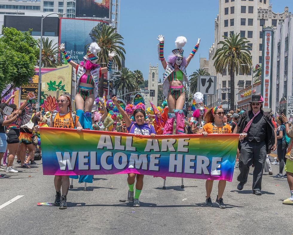 US v Skrmetti is a Public Health Disaster Los Angeles LGBTQIA pride parade all are welcome here banner sanctuary city