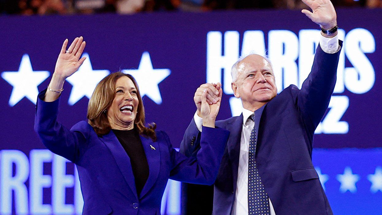 US Vice President 2024 Democratic presidential candidate Kamala Harris VP running mate Minnesota Governor Tim Walz wave crowd after speaking campaign rally Fiserv Forum Milwaukee Wisconsin