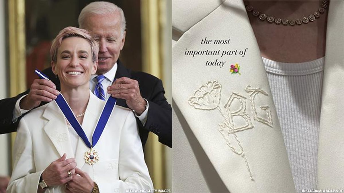 USWNT star soccer player Megan Rapinoe receiving the Presidential Medal of Freedom from President Joe Biden at the White House next to her lapel on a white suite showing support for WNBA star Brittney Griner.