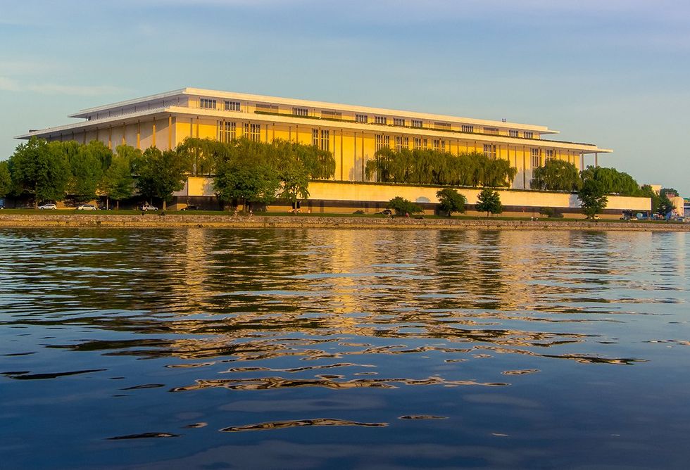 View of the John F Kennedy Center for the Performing arts from on Potomac River at sunset