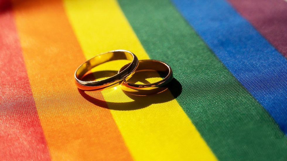 Wedding Rings on Pride Flag