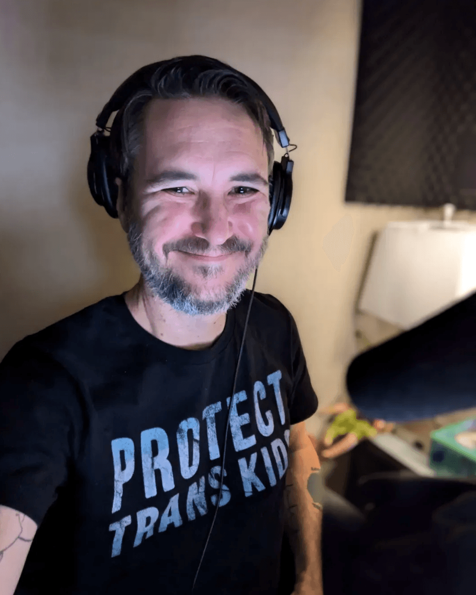 Wil Wheaton wears a "Protect Trans Kids" tee shirt in the recording studio as he narrates audiobooks.