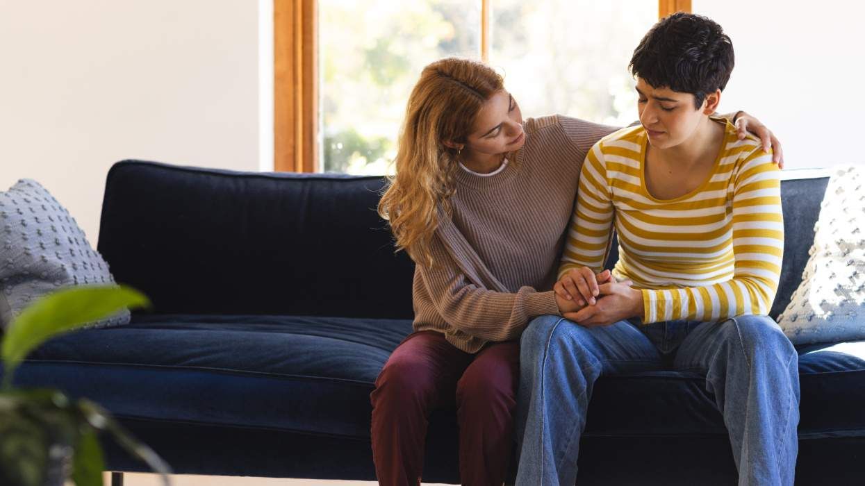Woman comforts gender-noncomforming person