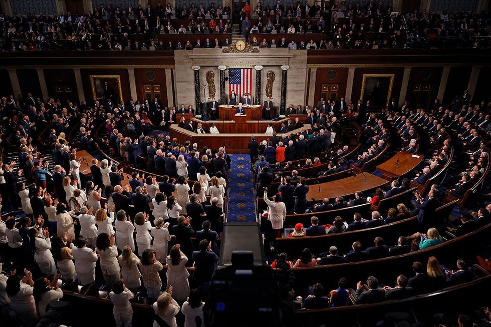 Women dressed white honor suffrage womens rights reproductive freedom gender equality President Joe Biden SOTU address House Chamber March 2024 Christopher Wiggins Press Corps balcony