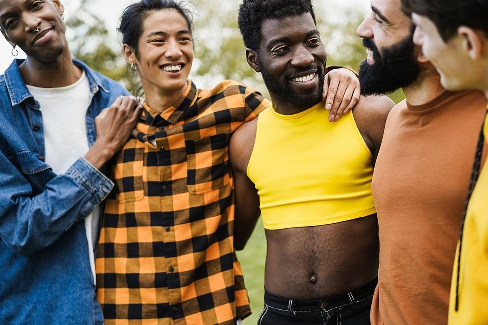 Young diverse men hugging each other at city park Cape Town South Africa