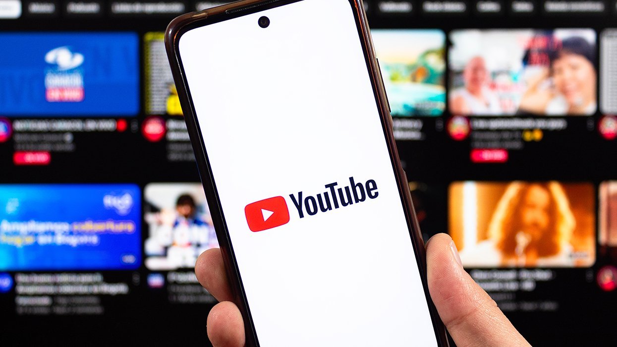 youtube on a smart phone in front of video wall