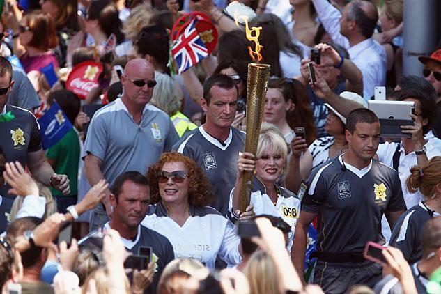 Ab Fab stars carry Olympic flame through London streets