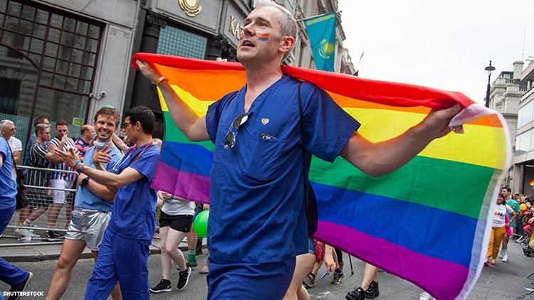 Medical worker with Pride flag