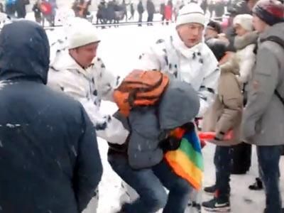 WATCH: Russian Activist Detained for Unfurling Rainbow Flag
