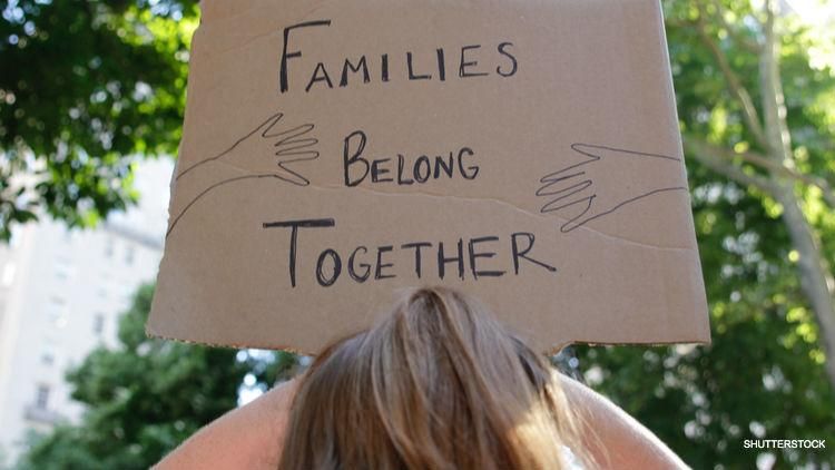 Families belong together sign