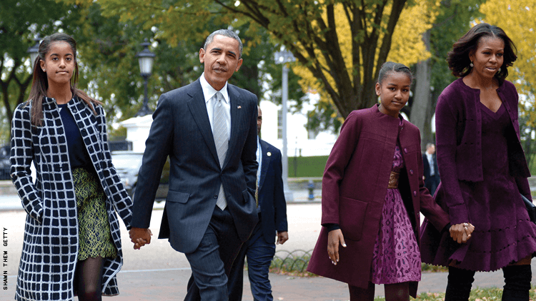 president obama michelle obama malia an sasha obama all walking down street a beautiful Black family 