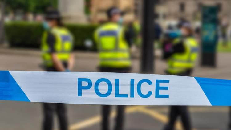 Police tape and police officers in Scotland