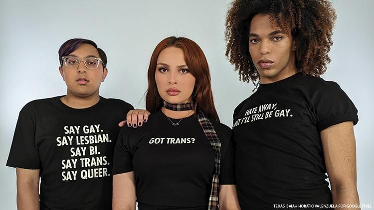 On The Advocate cover image, three lgbtq+ activists in black t shirts with white lettering gaze at the camera