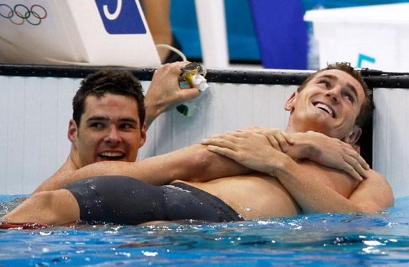 Male Olympic Swimmers Cuddle in Pool After Gold Medal Win