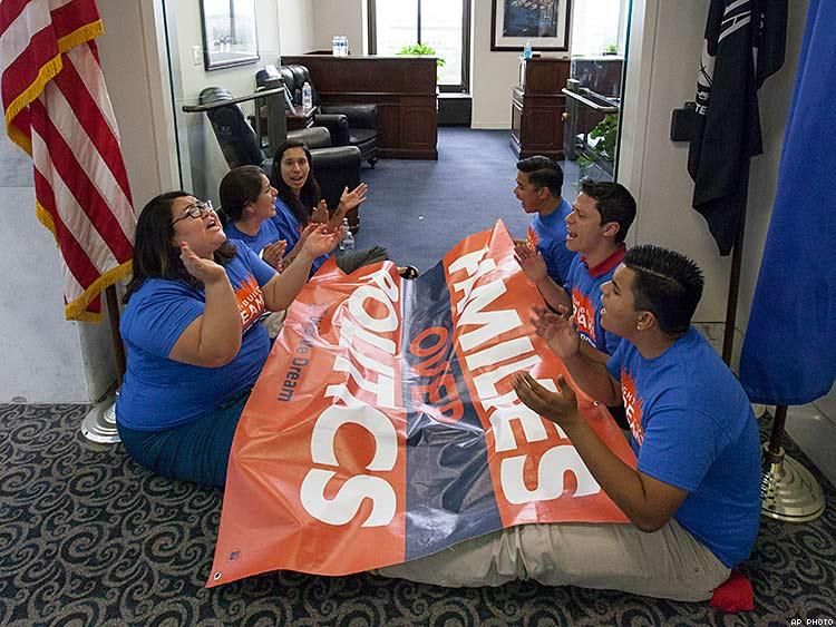 Protesters stage a sit-in at the state office of Senate Majority Leader Harry Reid in Washington in September of 2014.