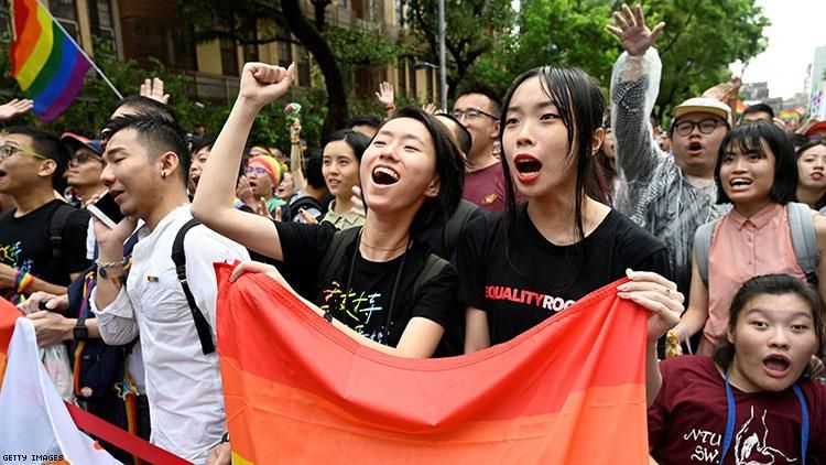 Supporters of same-sex marriage celebrate outside the parliament in Taipei on May 17, 2019.
