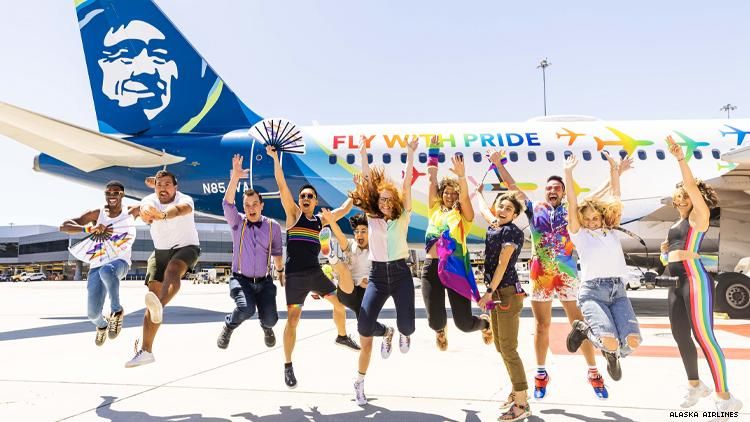 LGBTQ travel influencers in front of Alaska Airlines Pride plane