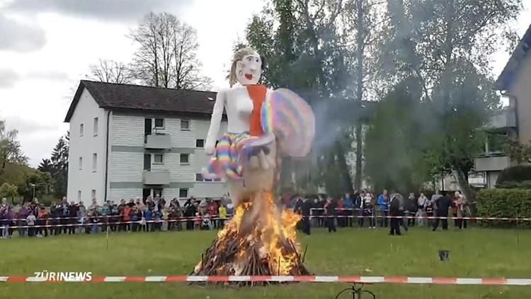 trans woman effigy being burned in Bassersdorf, Switzerland’s annual spring celebration